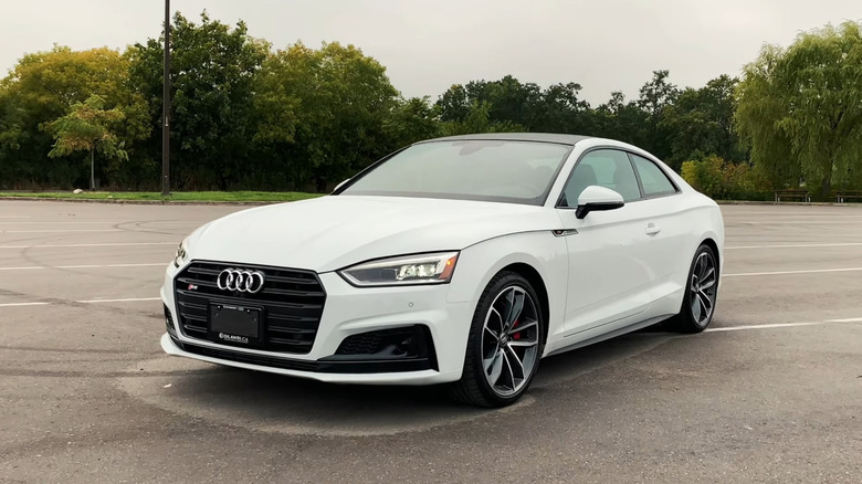 A front end shot of a white 2019 Audi S5 parked
