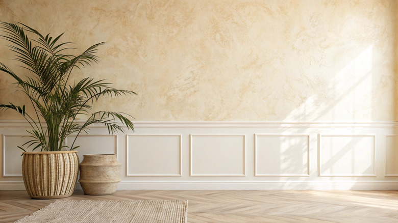 Tan textured wall with wainscoting framing