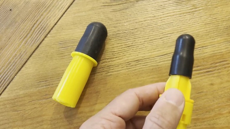 Two broken light bulb extractors