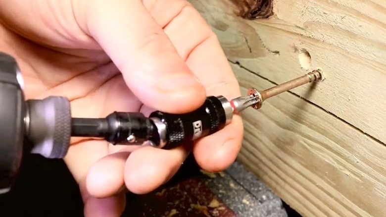 Close up of pivoting drill bit holder