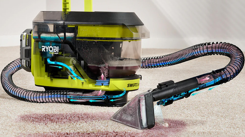 A Ryobi carpet cleaning machine cleaning a carpet