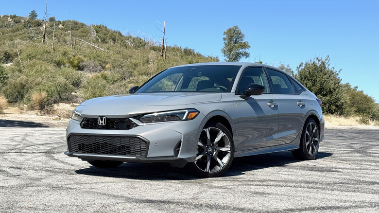 2025 Honda Civic Hybrid parked on a mountain road