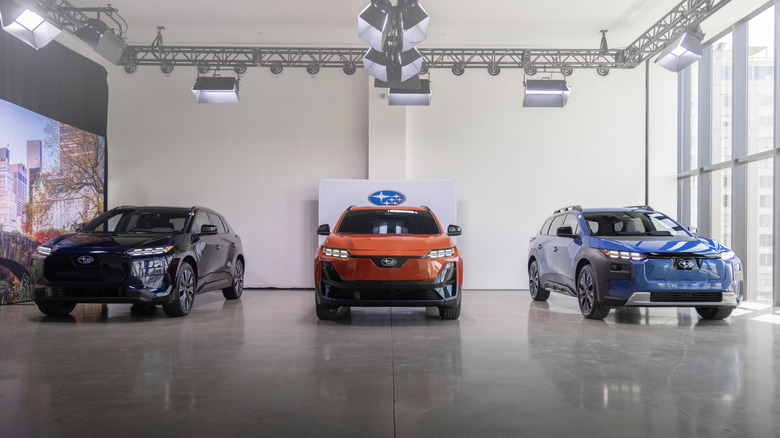 Subaru Solterra, Uncharted, and Trailseeker trims parked in a showroom