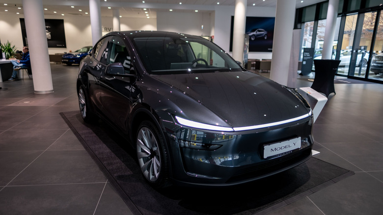 Black Tesla Model Y in showroom
