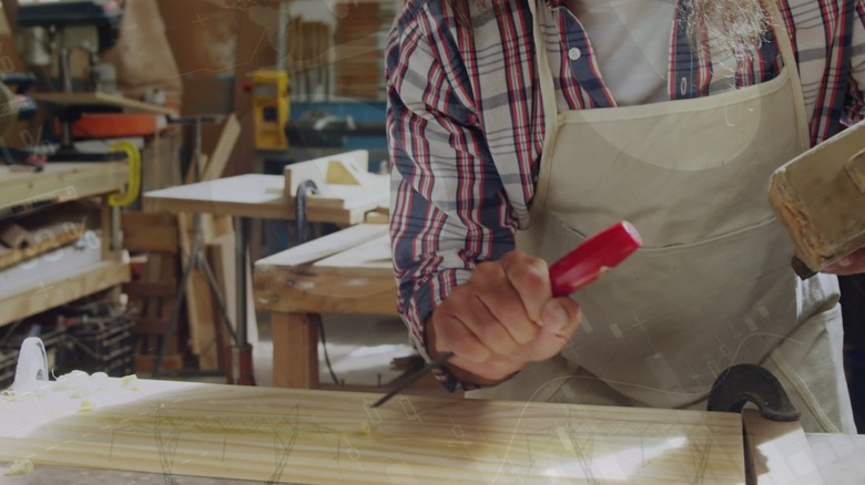 a person woodworking with a chisel
