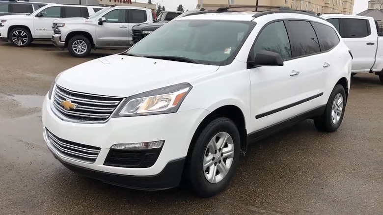 A white 2016 Chevrolet Traverse parked in a dealership