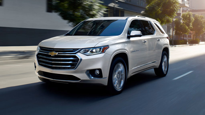 A white 2021 Chevrolet Traverse driving