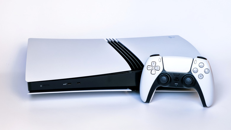 A PS5 and controller against a white background.