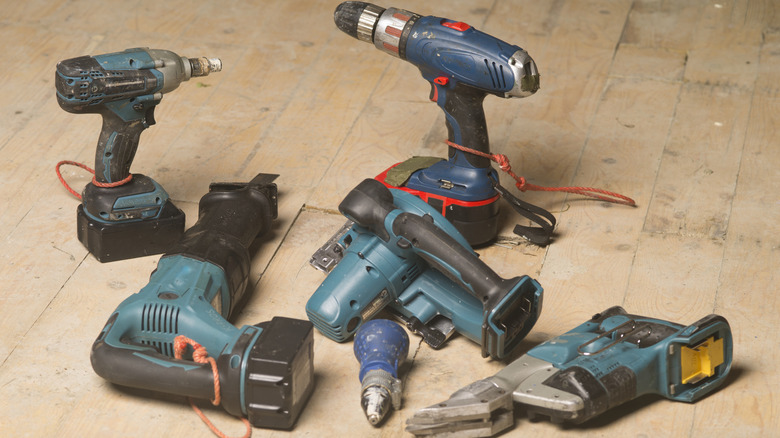 Cordless power tools on wood floor