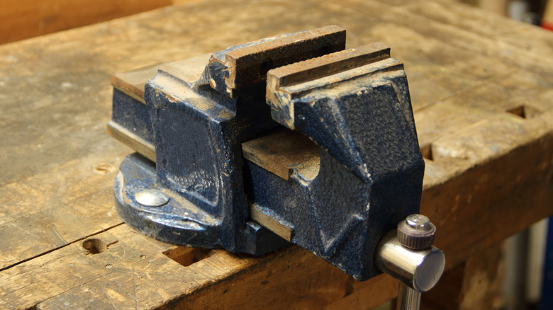 Benchtop vise on workbench