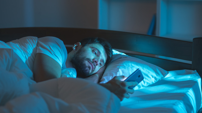 Man using phone at night