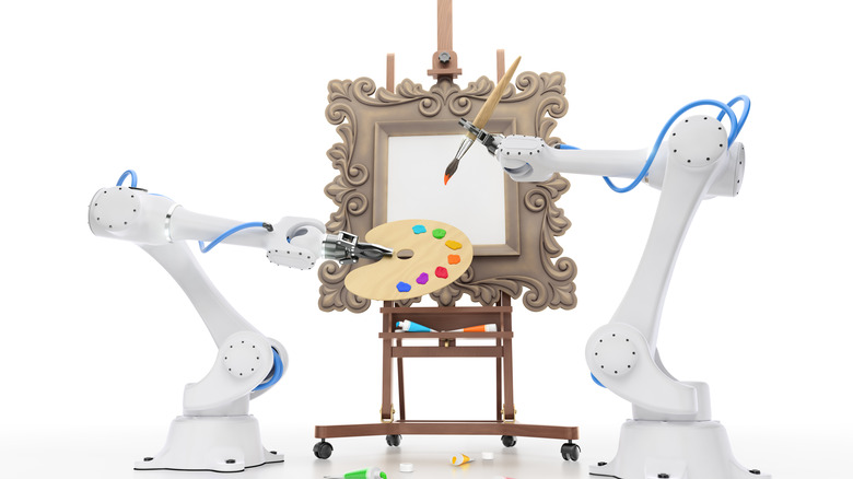 Two robot arms painting canvas