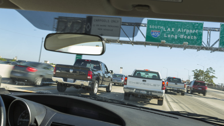 Several cars driving through Los Angeles.