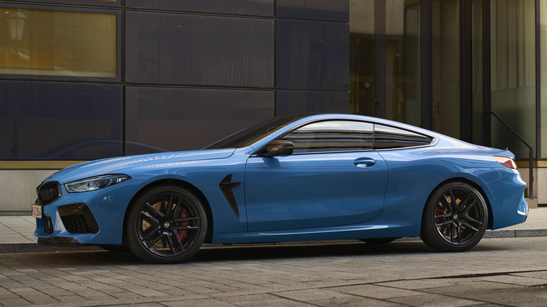 Front 3/4 view of BMW M8 Coupe in city setting