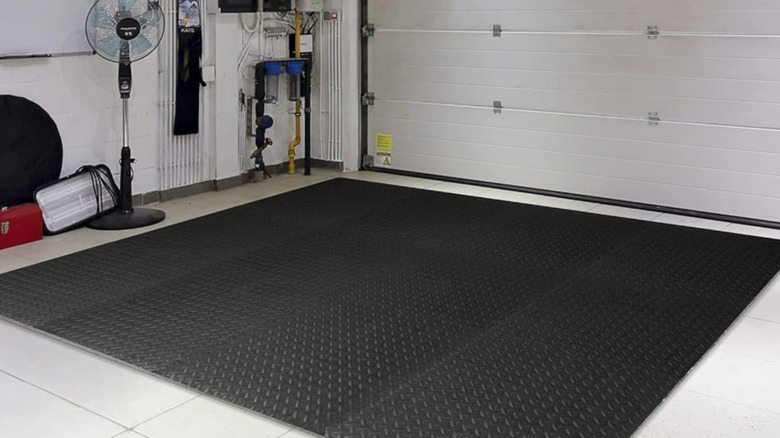 Interlocking floor mats on a garage floor.