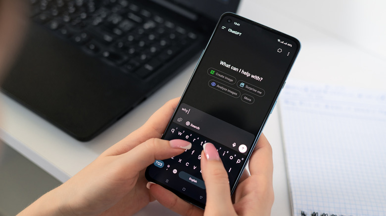 Person typing on smartphone with ChatGPT app open