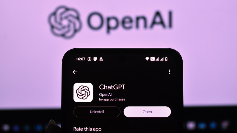 Smartphone showing ChatGPT on the Google Play Store with OpenAI logo in the background