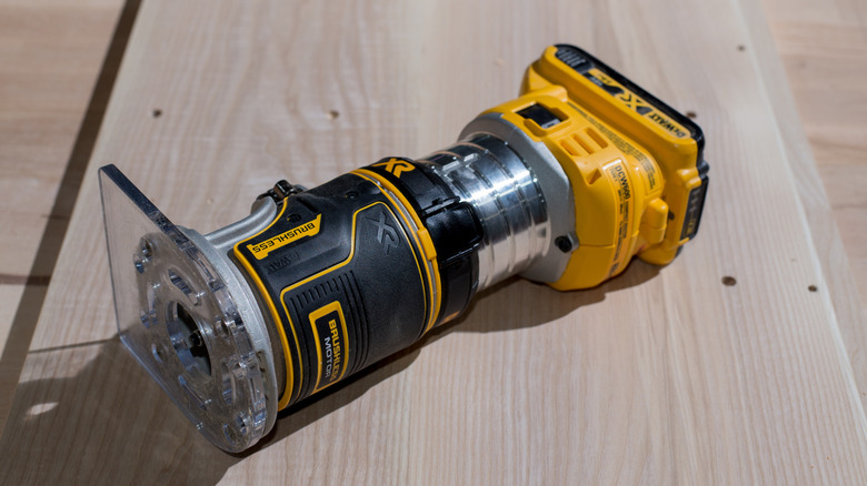 A DeWalt wood router on a wooden surface