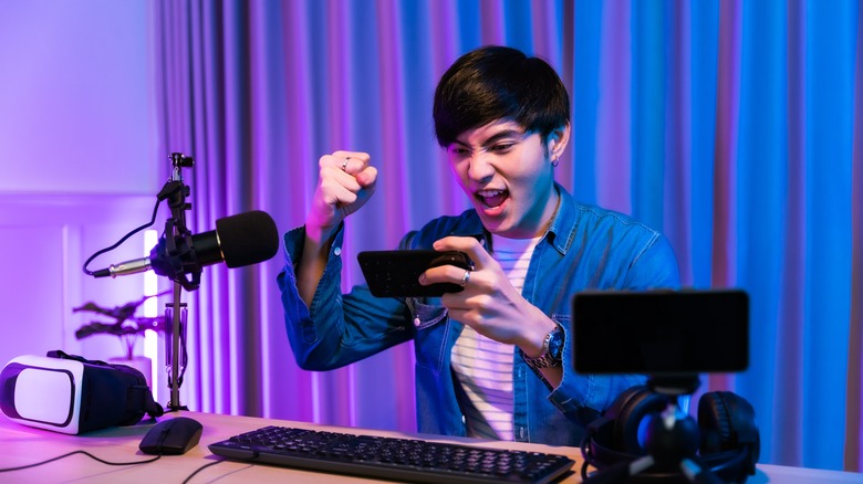 man streaming with phone