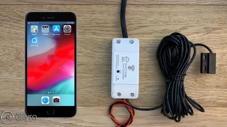 The eKyro smart garage door controller kit shown with a smartphone.