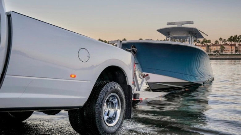 Back of pickup towing a boat