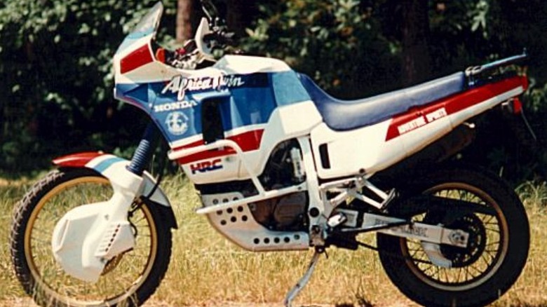 A Honda Africa Twin 650 parked in a grassy area.jpg