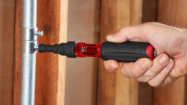 Person using a Doyle reaming screwdriver
