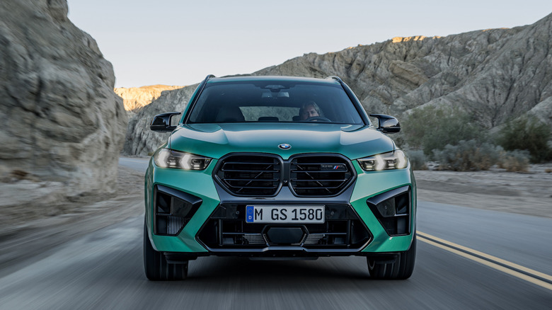 BMW X6 driving down the highway