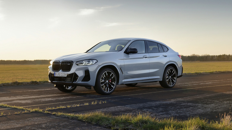 BMW X4 parked near a field