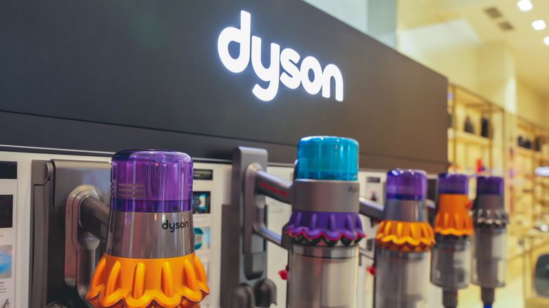An in-store display of multiple Dyson vacuum cleaners