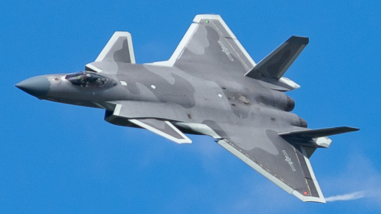 Chengdu J-20 fighter jet banking in flight