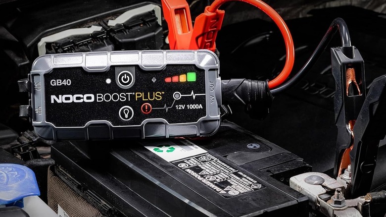 NOCO Boost GB40 jump starter attached to car battery
