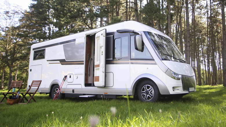 An RV in the woods.