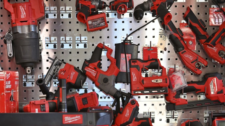 Milwaukee tools on metal rack