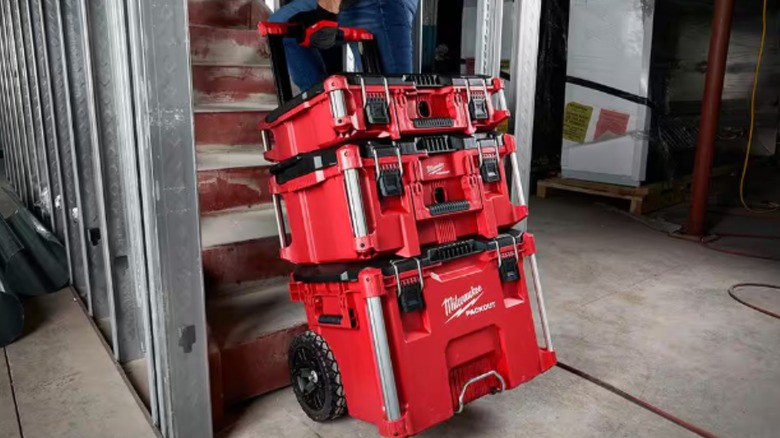 A person pulling a Milwaukee packout modular rolling tool box