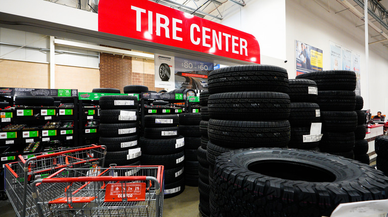 A close up of a Coscto tire center offering tires