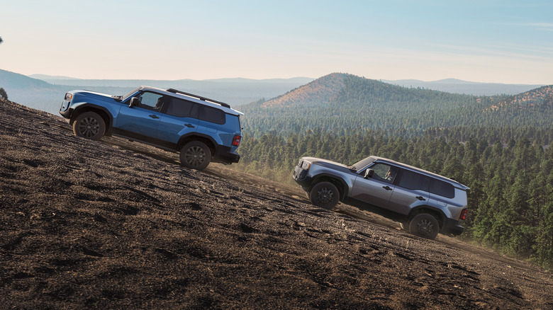 Blue and silver 2026 Toyota Land Cruisers on trail