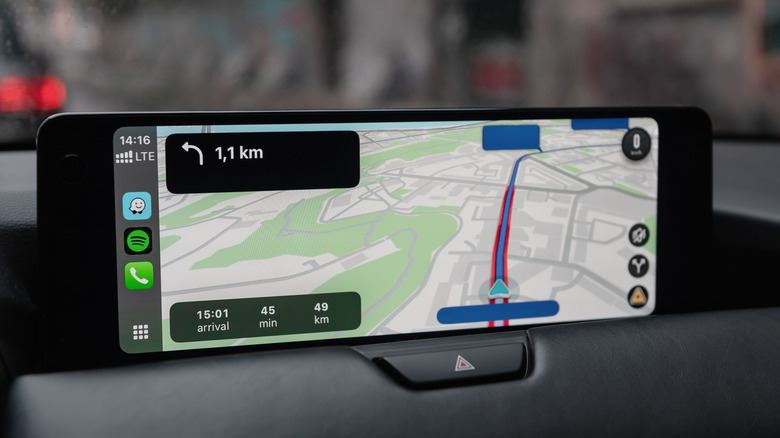 A car's central infotainment system showcasing Apple CarPlay maps.