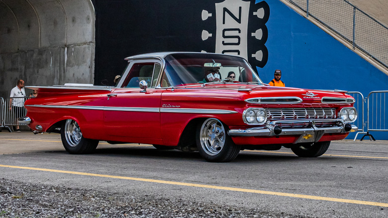 A Red Chevrolet El Camino pickup custom lowrider