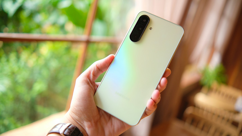 A person holding a Samsung Galaxy A36 smartphone