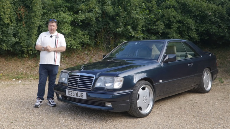 Jay Emm standing next to a classic Mercedes coupe