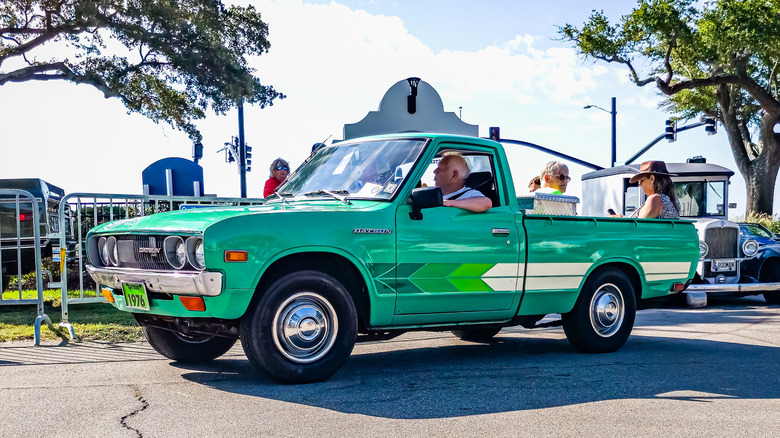 Datsun 620 pickup truck at car show