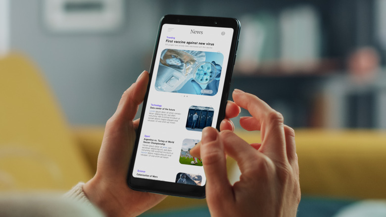 woman reading news on phone