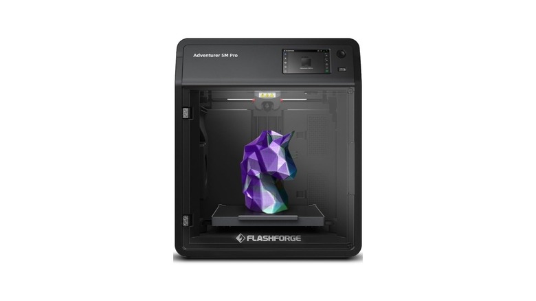 The Flashforge AD5M Pro 3D printer with a unicorn figure inside.