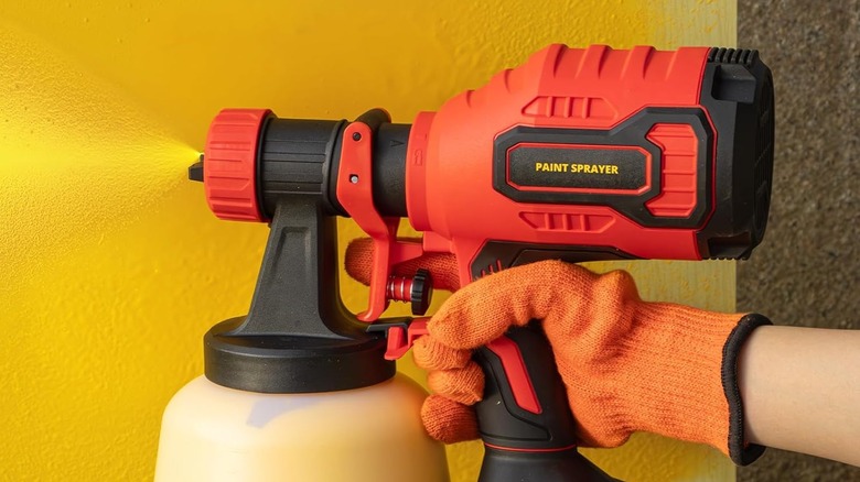 A person using a 3D VO INN Paint Sprayer.