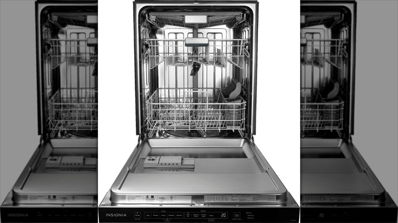 Empty Insignia NS-DWR3SS1 24-inch Top Control Built-In Dishwasher with door fully open