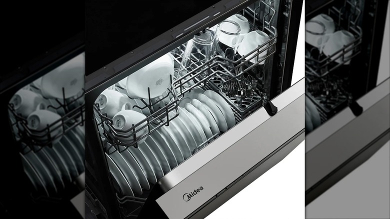 Midea MDF24P2B 24-inch Front Control Dishwasher filled with dishes and with door partially open