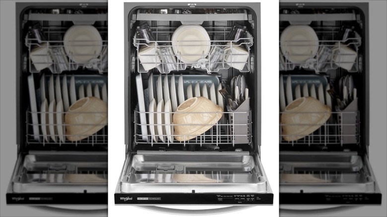 Whirlpool WDT730HAMZ Eco Series 24-inch Top Control Built-in Dishwasher filled with dishes and with door fully open