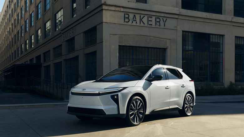 2026 Toyota bZ, front-left 3/4 view parked in urban landscape