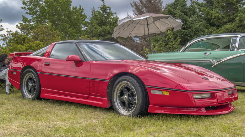 Red 1987 Chevrolet Corvette at classic car show